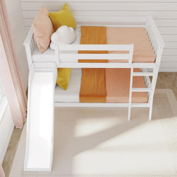 Children's white bunk bed with slide, featuring orange and yellow bedding and a cloud pillow in a bright room.