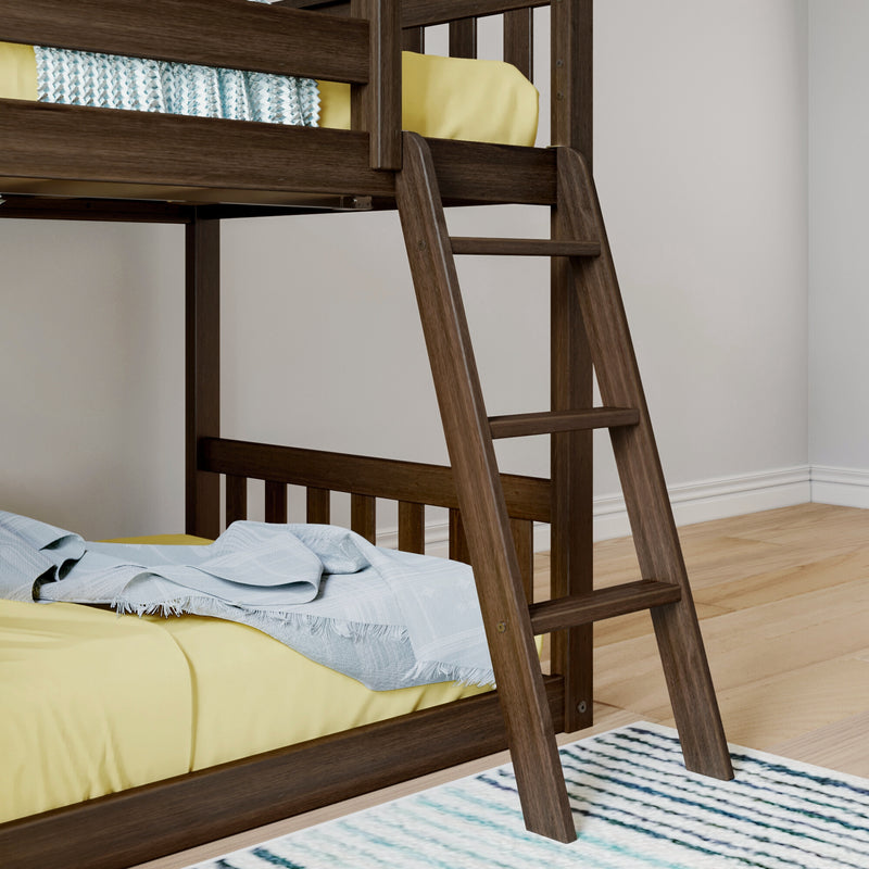 Close-up of a dark wooden bunk bed ladder with yellow bedding and a light blue throw in a modern kids' bedroom with hardwood floors and a striped rug