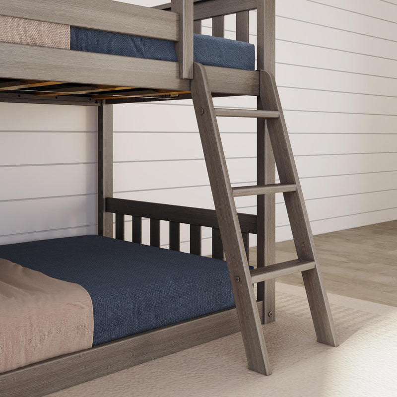 Gray wooden bunk bed with angled ladder and navy bedding in a modern farmhouse bedroom