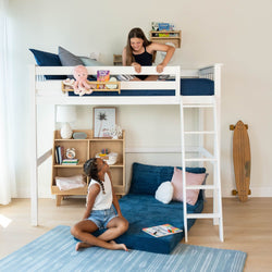 Girls playing in a modern bedroom with a white bunk bed and colorful decorations.