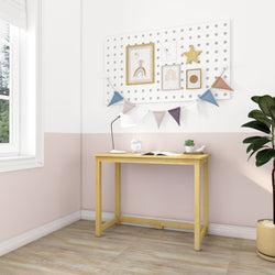 Stylish modern workspace with wooden desk, wall art, pendant lamp, and decorative banners in a cozy room setting.