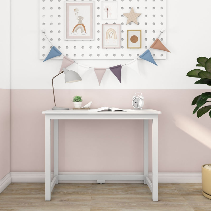 White Scandinavian kids desk with lamp, succulent and alarm clock beneath pegboard gallery wall featuring pastel bunting, rainbow nursery prints and wooden star, children's room decor