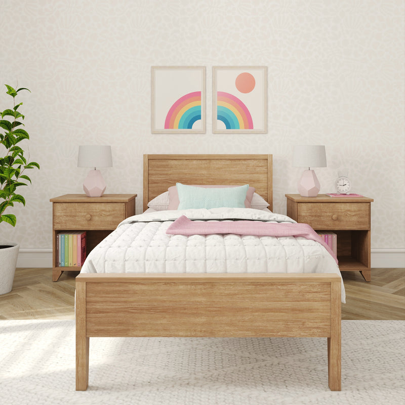 Cozy pastel children's bedroom interior with wooden bed, pink bedside lamps, rainbow framed wall art, patterned wallpaper and houseplant
