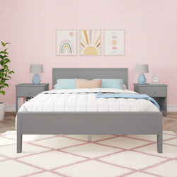 Stylish bedroom interior with gray bed frame, patterned wallpaper, bedside tables, and modern decor elements.