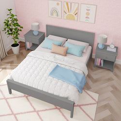 Modern bedroom with gray bed frame, pastel pillows, and geometric art decor.