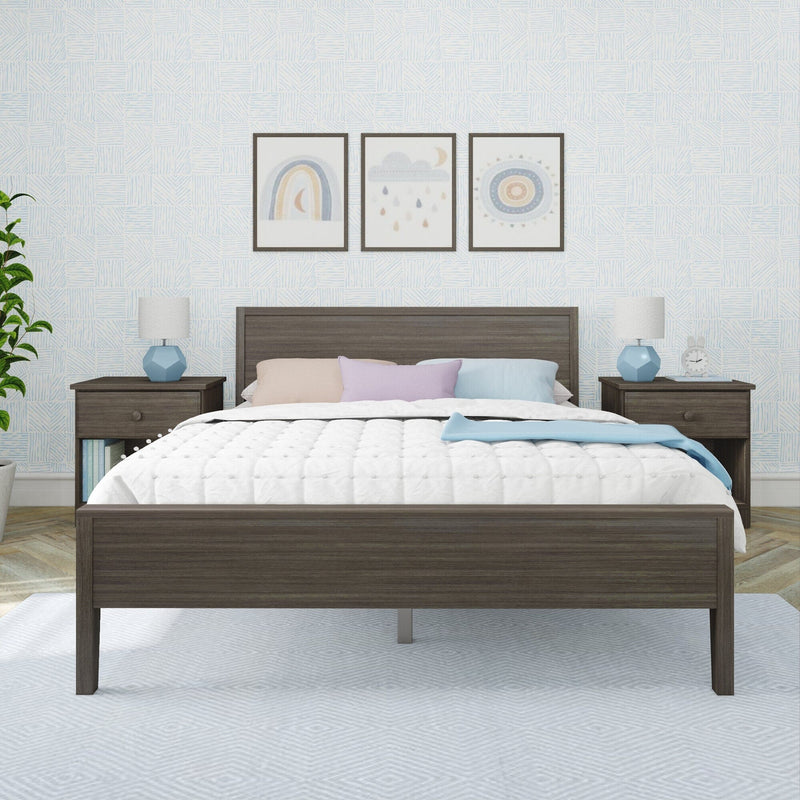 Modern nursery bedroom with dark wood platform bed, quilted white bedding, pastel pillows, blue geometric bedside lamps, patterned light-blue wallpaper and three framed rainbow and cloud prints