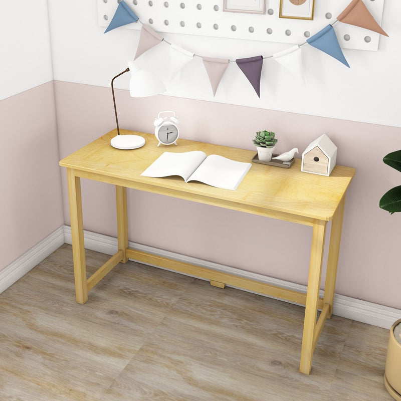 Minimalist light-wood desk workspace in a pastel nursery with an open notebook, white task lamp, vintage-style alarm clock, potted succulent and decorative bunting flags