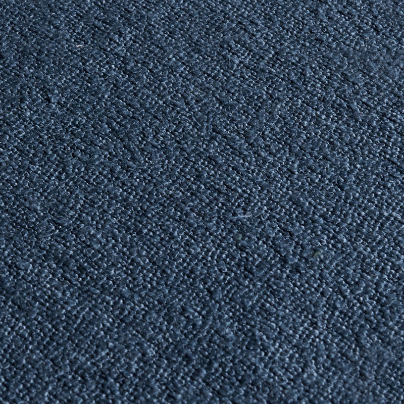 Close-up of navy blue loop-pile carpet texture, soft durable carpet flooring background