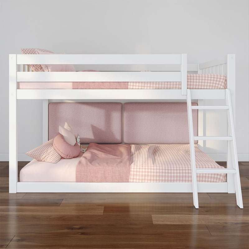 White wooden bunk bed with ladder and pink gingham bedding, cozy children's bedroom décor, modern loft-style bed on hardwood floor