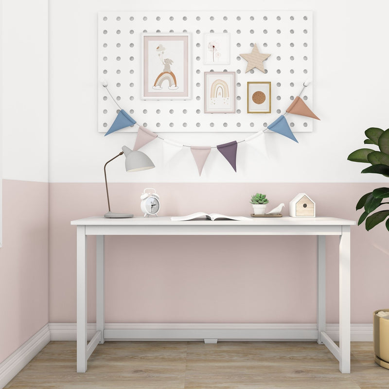 Children's Scandinavian nursery desk with white table, pegboard gallery wall featuring rainbow and bunny art, pastel bunting, wooden star, desk lamp, alarm clock and succulent
