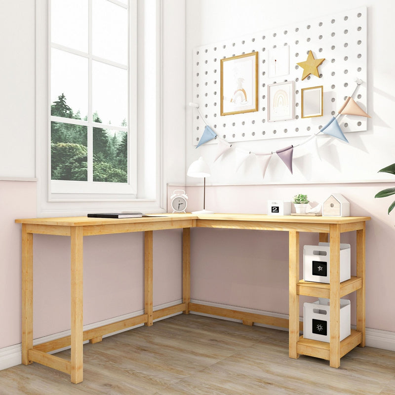 L-shaped wooden desk in a bright room with wall decorations and natural light from a large window.
