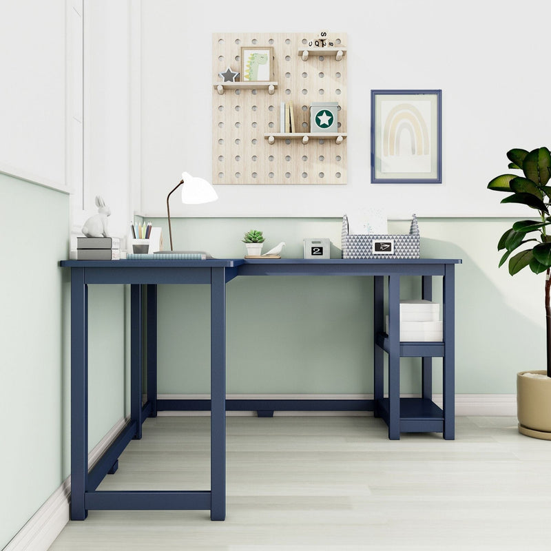 L-shaped navy blue wooden corner desk with open shelving, white desk lamp, storage boxes, pegboard organizer and potted plant in a modern pastel home office