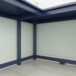 Steel structure joints under a table with light blue panels and flooring, emphasizing modern office furniture design.
