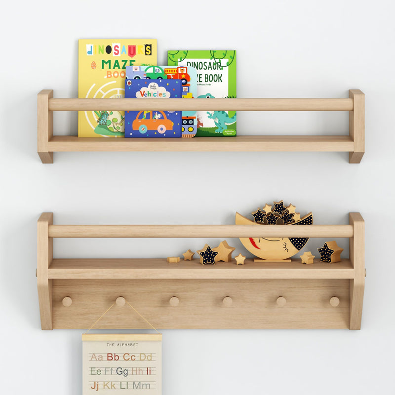 Wooden nursery wall shelf with colorful children's board books (dinosaurs maze, vehicles) and wooden moon-and-star toys on a light gray wall