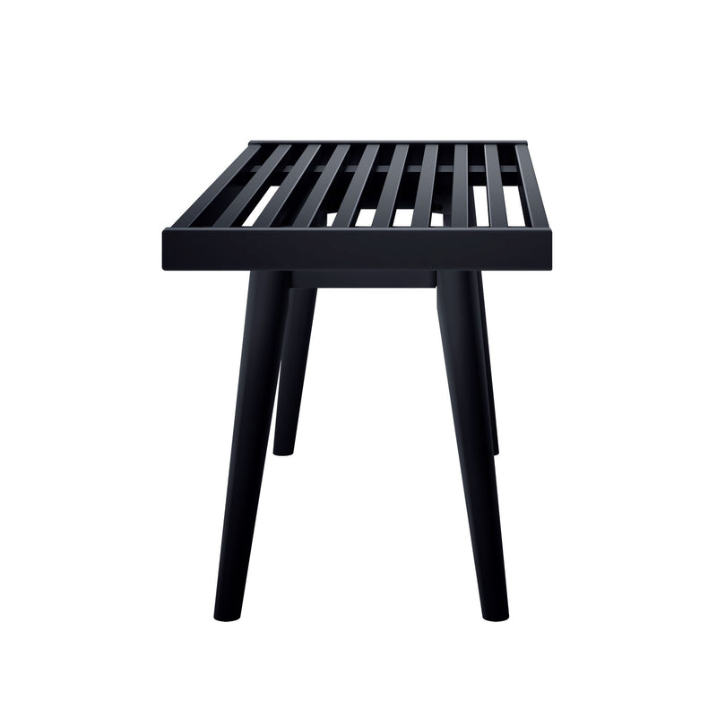 Black slatted bench stool with tapered legs, modern minimalist outdoor patio seating on white background