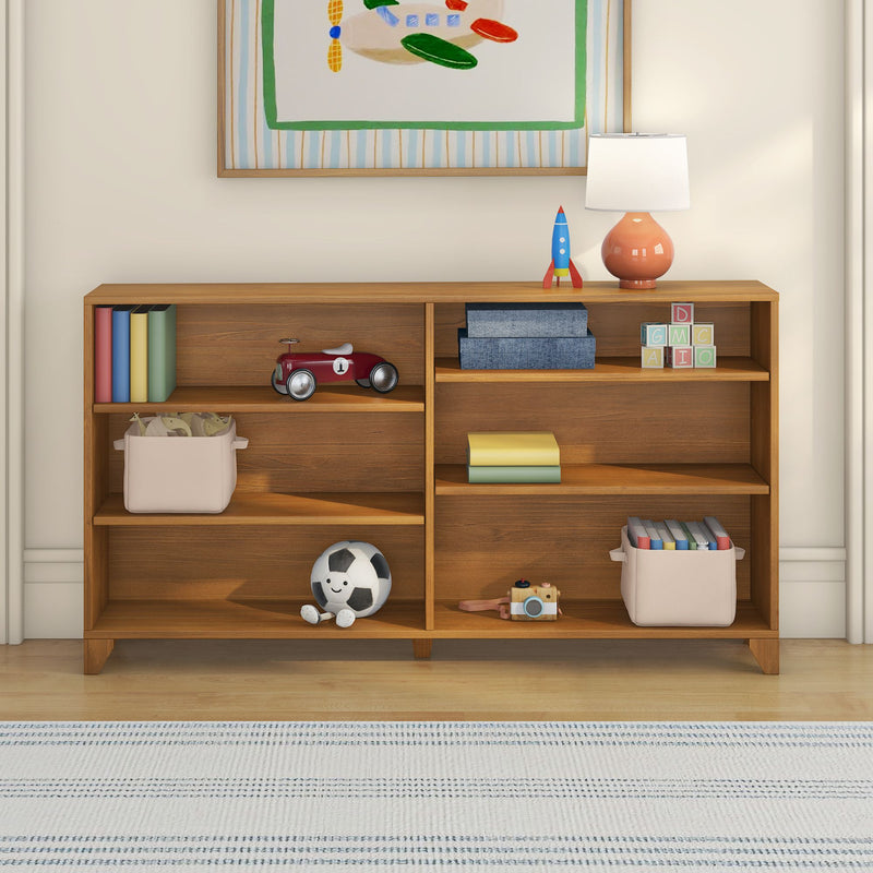 Wooden nursery bookshelf with organized kids' toys and storage baskets — red toy car, blue rocket, stacking blocks, plush soccer ball, coral lamp and framed airplane art