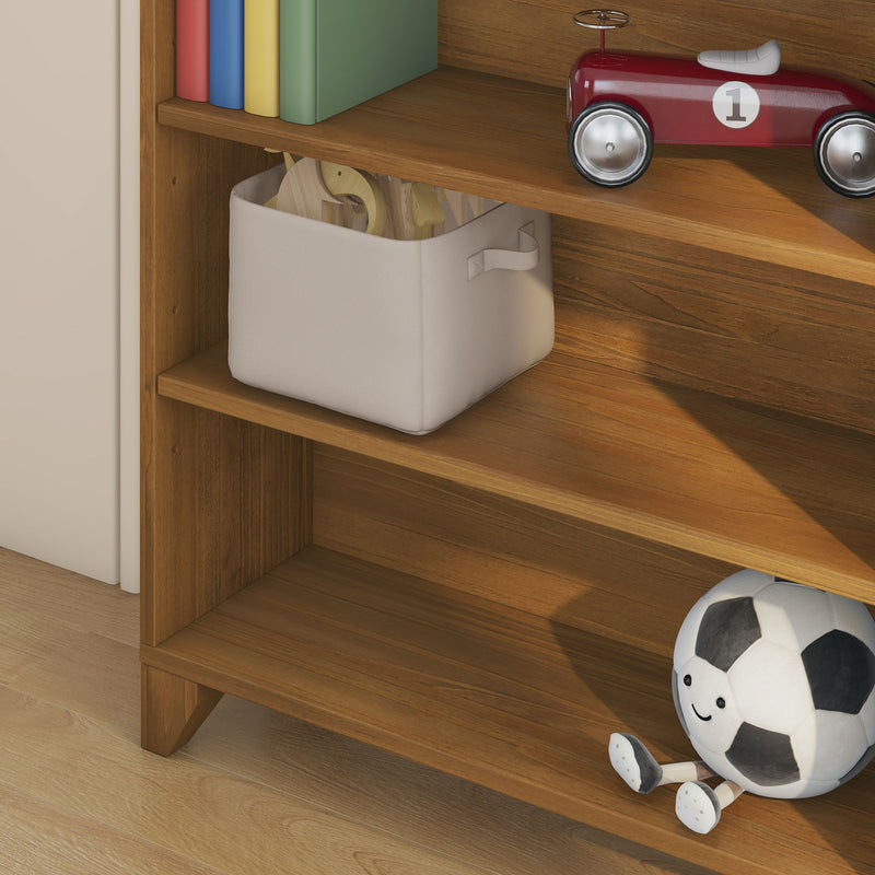Wooden bookshelf with beige fabric toy bin, colorful children's books, red vintage toy car (number 1), and smiling plush soccer ball