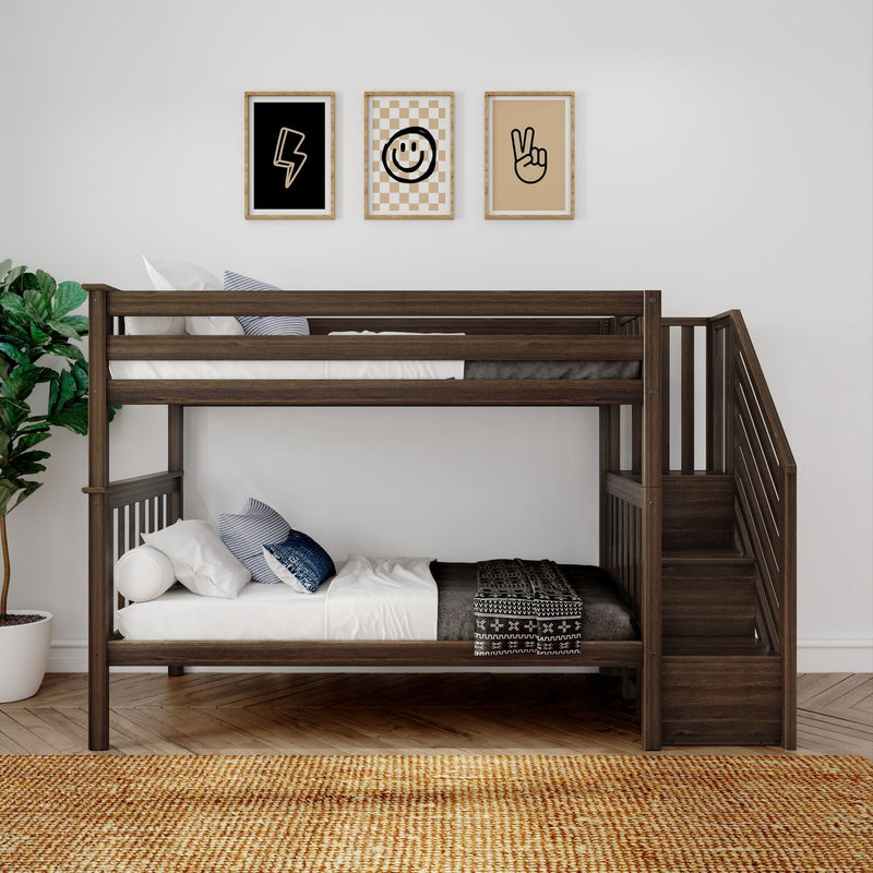 Dark wood bunk bed in a modern kids' nursery with stairs, white bedding, patterned throw, potted plant and three framed minimalist prints (lightning bolt, smiley, peace)