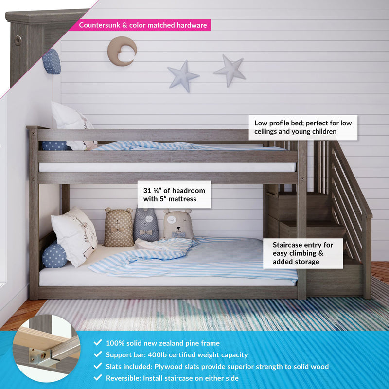 Gray solid pine low-profile kids loft bunk bed with staircase storage, built-in safety rails, reversible staircase and countersunk hardware, styled with striped bedding and plush pillows