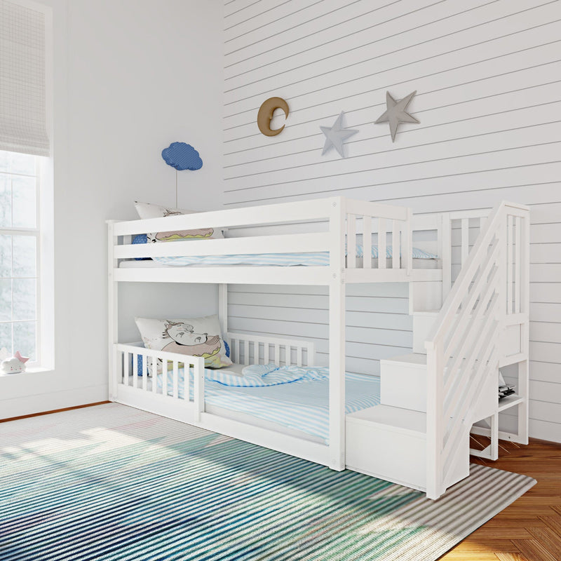 White wooden bunk bed in modern kids' bedroom with blue striped bedding, unicorn pillows, cloud and star wall decor on white shiplap, natural window light