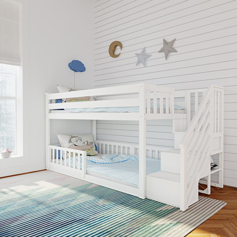 White wooden bunk bed in bright kids' bedroom with striped rug, unicorn pillows and star, moon and cloud wall decor