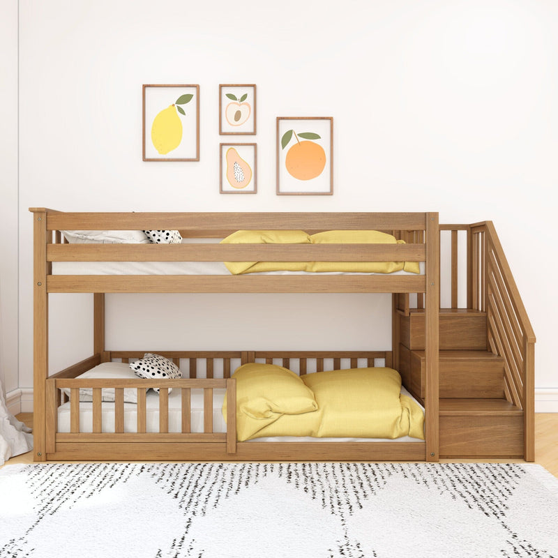 Space-saving wooden bunk bed with built-in stairs, yellow bedding and fruit wall art in a minimalist children's nursery with white walls