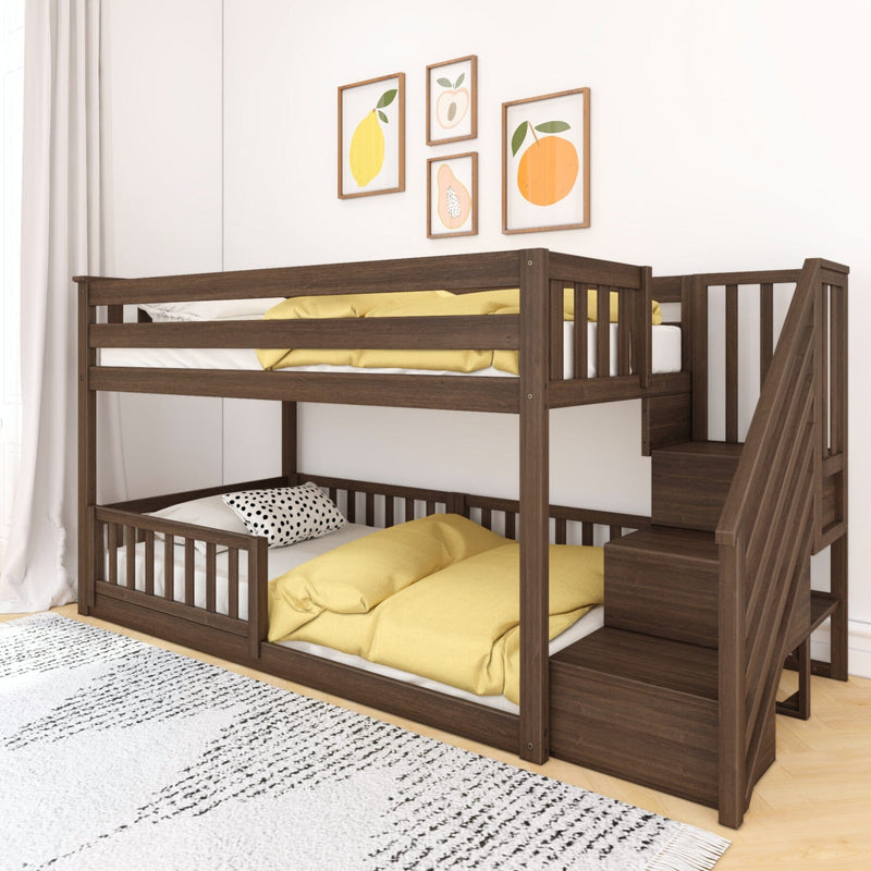 Dark wood bunk bed with staircase and safety rails in kids' room with yellow bedding and fruit-themed wall art, modern nursery decor
