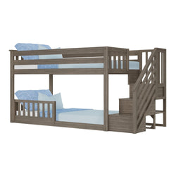 Wooden bunk bed with safety railing and side stairs, featuring blue bedding.