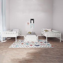 White children's bedroom with three matching toddler beds and wooden flooring.