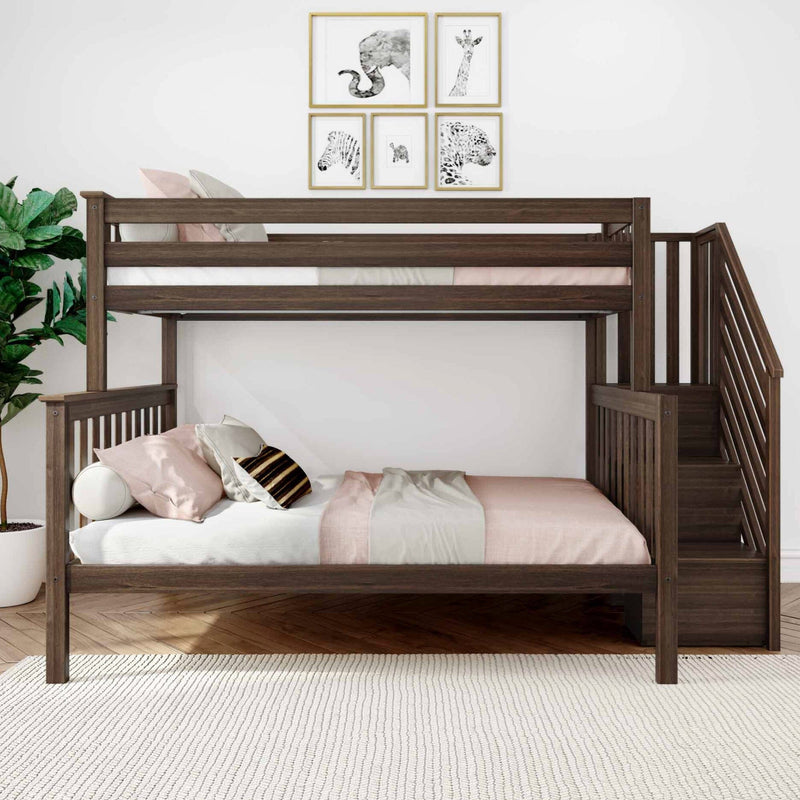 Dark wood twin-over-full bunk bed with staircase and built-in storage steps in a modern kids bedroom, blush pink bedding, decorative animal wall art, indoor plant and white area rug