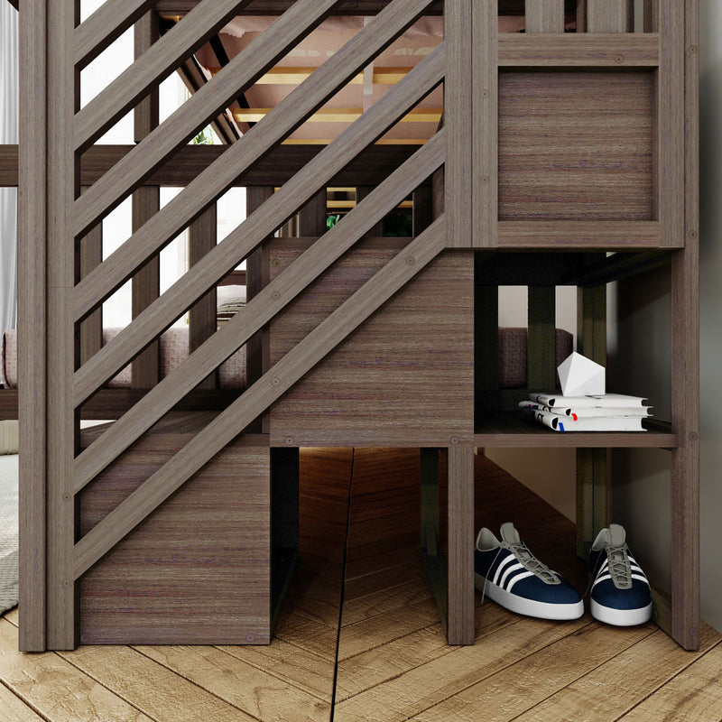 Modern wooden bunk bed with diagonal slat railing and built-in storage cubbies holding stacked books, white geometric decor and navy sneakers on hardwood floor