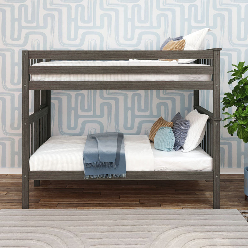 Gray wooden bunk bed in modern kids' bedroom with white bedding, blue throw and decorative pillows, light blue geometric wallpaper and hardwood floors