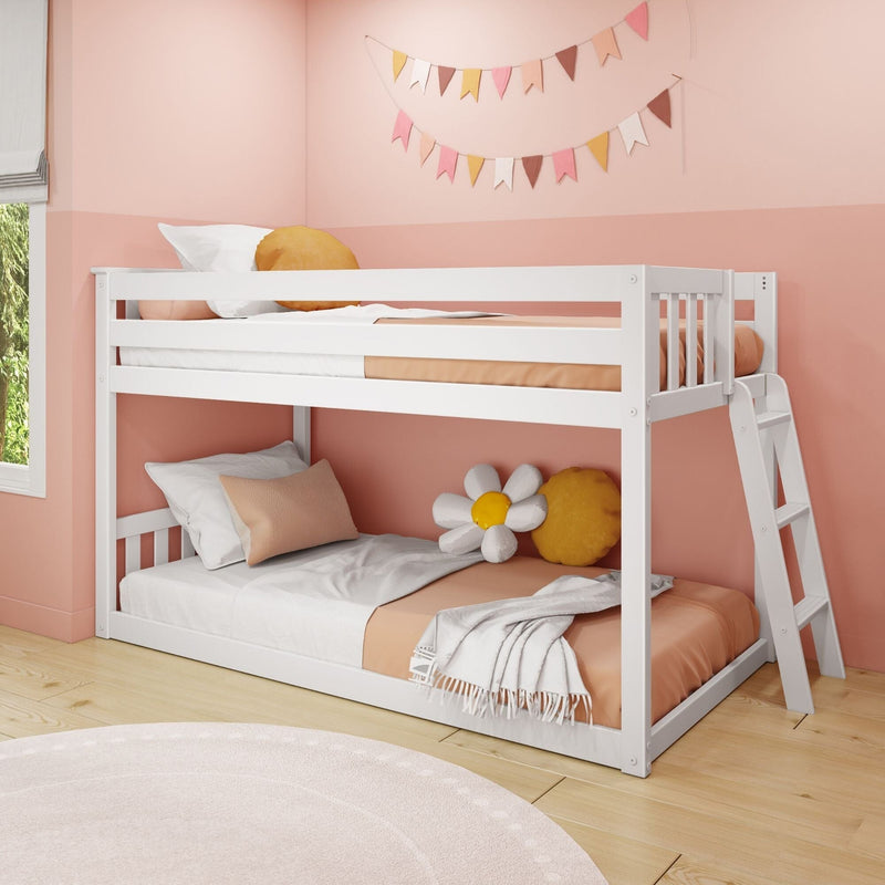 White wooden bunk bed with ladder in pink kids' bedroom, peach bedding, daisy pillow and decorative bunting