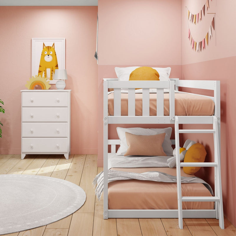 Pink children's bedroom with white wooden bunk bed, peach bedding, yellow round pillows, white dresser, cat wall art and pastel bunting