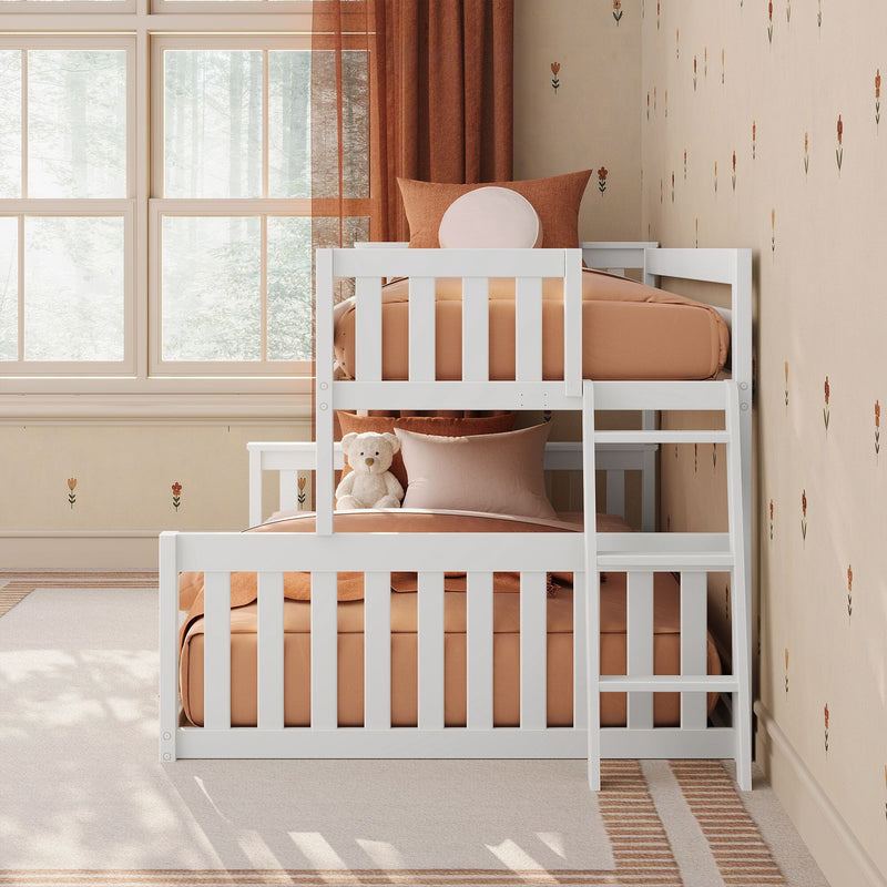 White bunk bed with terracotta peach bedding and teddy bear in a cozy children's nursery featuring floral wallpaper, rust curtains and bright forest-view windows