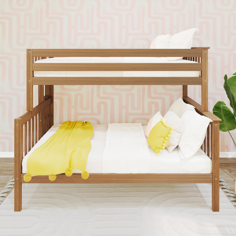 Wooden bunk bed with white linens and yellow pom-pom throw pillow in a modern kids' bedroom with pink geometric wallpaper and a green houseplant