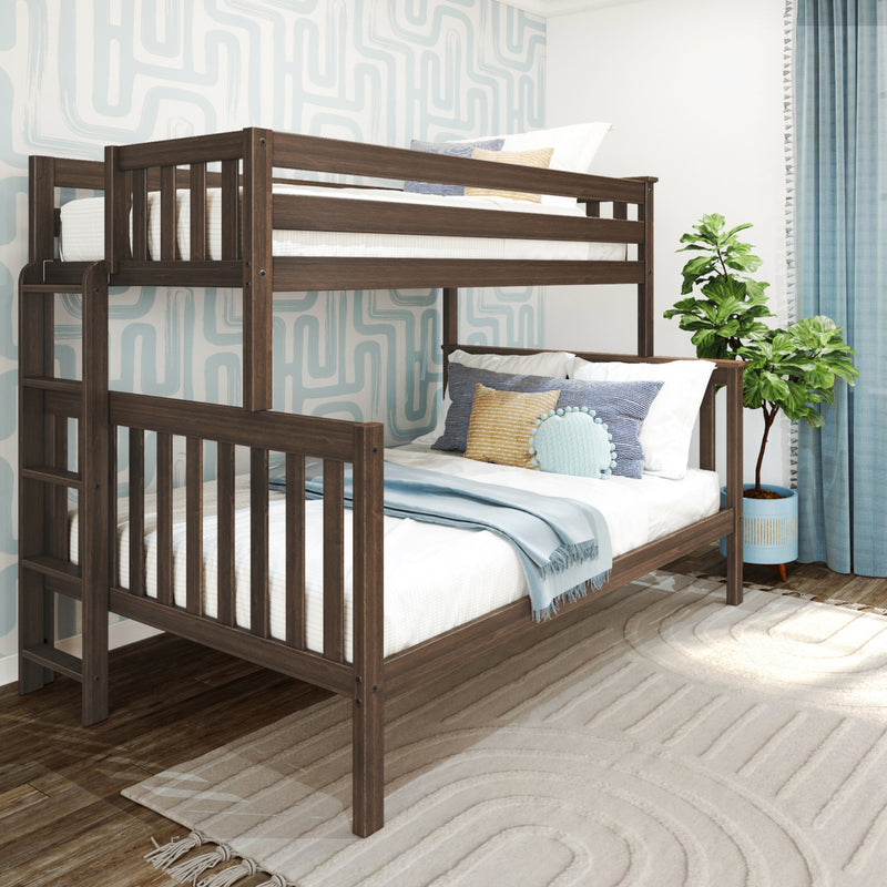 Twin-over-twin dark wood bunk bed in a kids' bedroom with light blue geometric wallpaper, blue-and-white bedding, decorative pillows and potted plant