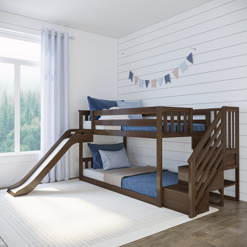 Wooden kids bunk bed with slide in a bright coastal-style children's bedroom featuring blue bedding, shiplap wall, window and curtains