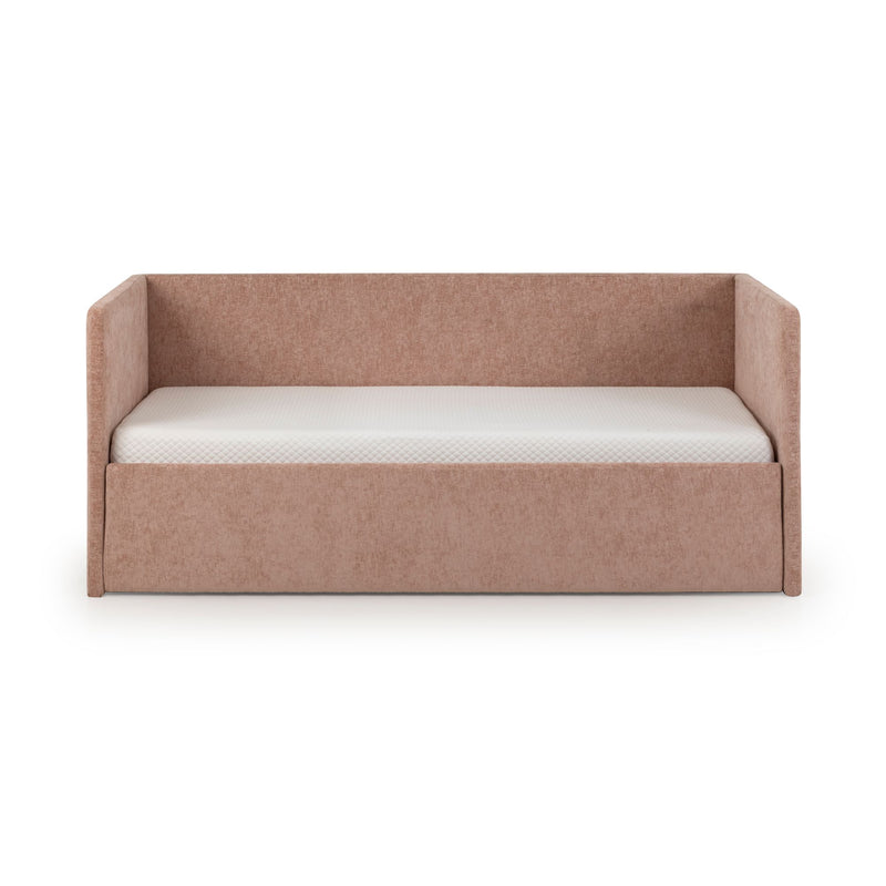 Blush pink upholstered daybed with tall back and side rails and white mattress — modern kids' sofa bed for nursery or guest room