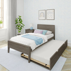 Stylish modern bedroom with twin trundle bed, cozy white bedding, and soft blue accents.