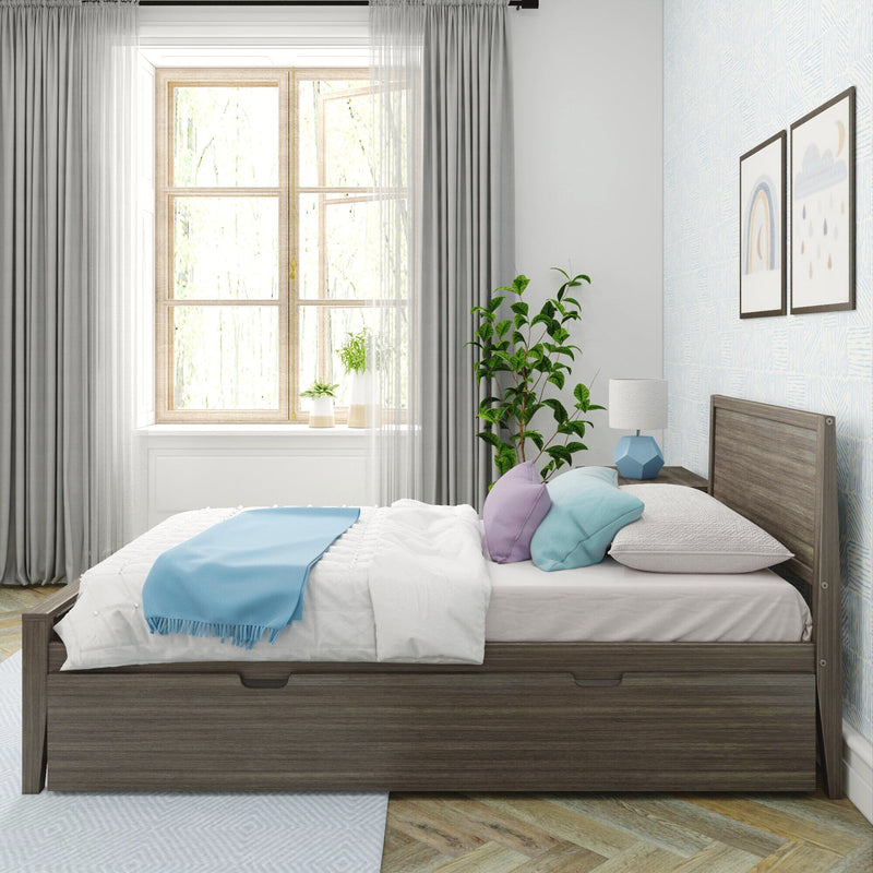 Modern bedroom with wood platform storage bed, white bedding and blue throw, pastel pillows, geometric lamp on nightstand, potted plant by large window with curtains