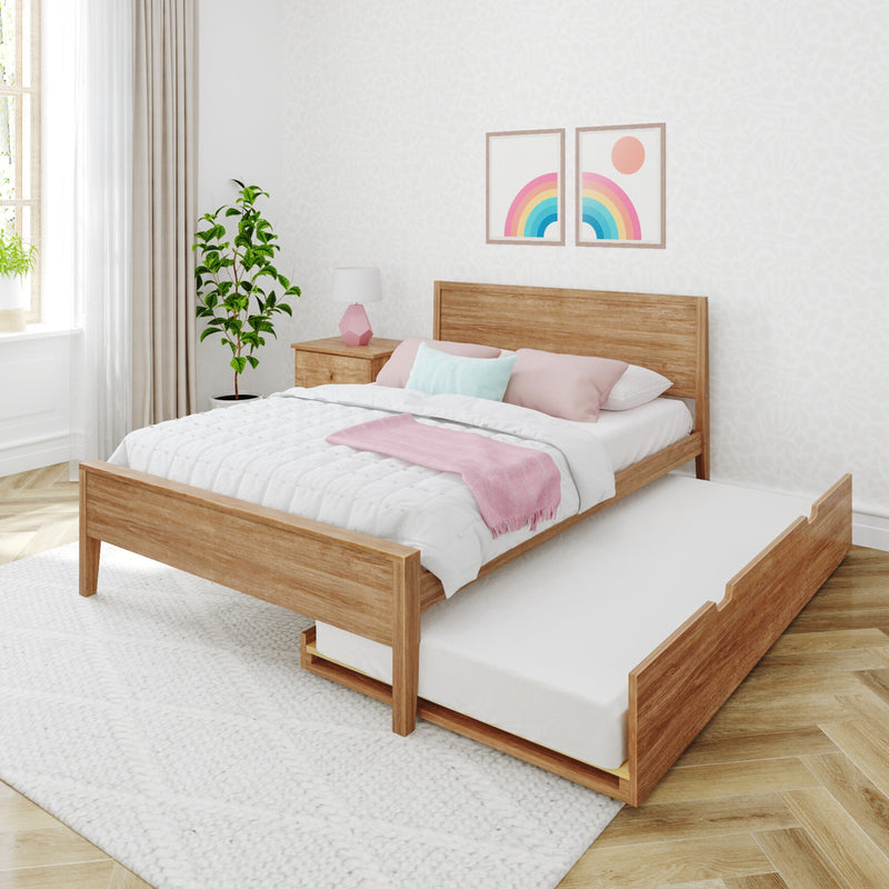 Sunlit minimalist bedroom with wooden platform trundle bed, pastel pink and white bedding, rainbow wall art, bedside lamp and potted plant