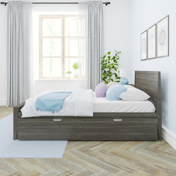 Modern gray wood storage platform bed in a bright minimalist bedroom with pastel blue and lavender pillows, light blue throw, large window, potted plant and herringbone hardwood floor