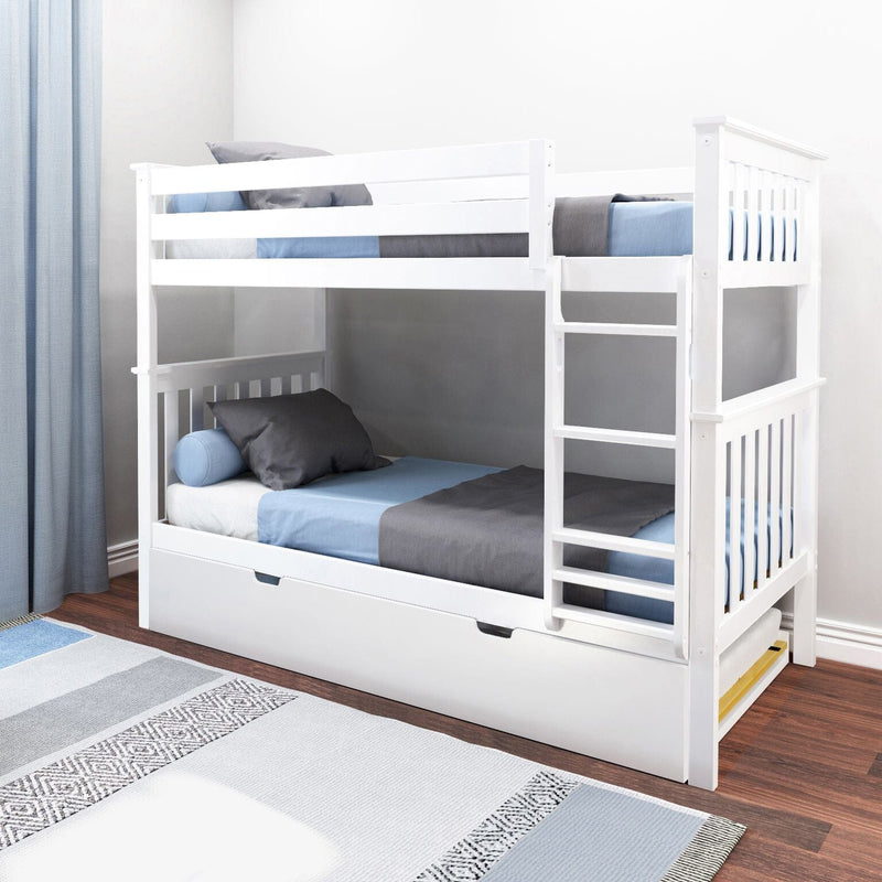 White wooden twin-over-twin bunk bed with ladder and pull-out trundle drawer, blue and gray bedding in a space-saving kids bedroom on hardwood floor