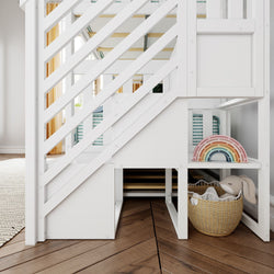White loft bed with built-in shelving, featuring colorful rainbow decoration and cozy basket on wooden floor.