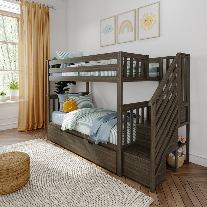 Gray wooden twin-over-twin bunk bed with storage stairs, striped bedding, sun plush and rainbow wall art in kids' bedroom