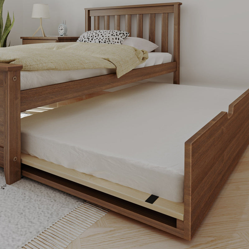 Wooden pull-out trundle bed with white mattress beneath matching wooden bed, beige duvet and spotted pillow — space-saving guest bed for modern bedrooms