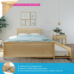 Natural pine platform bed with pull-out trundle, blue polka-dot duvet, matching nightstand in minimalist bedroom