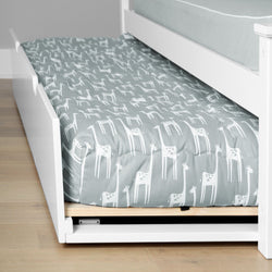 White under-bed trundle with grey and white giraffe-print twin mattress and fitted sheet on hardwood floor — children's bedroom bedding