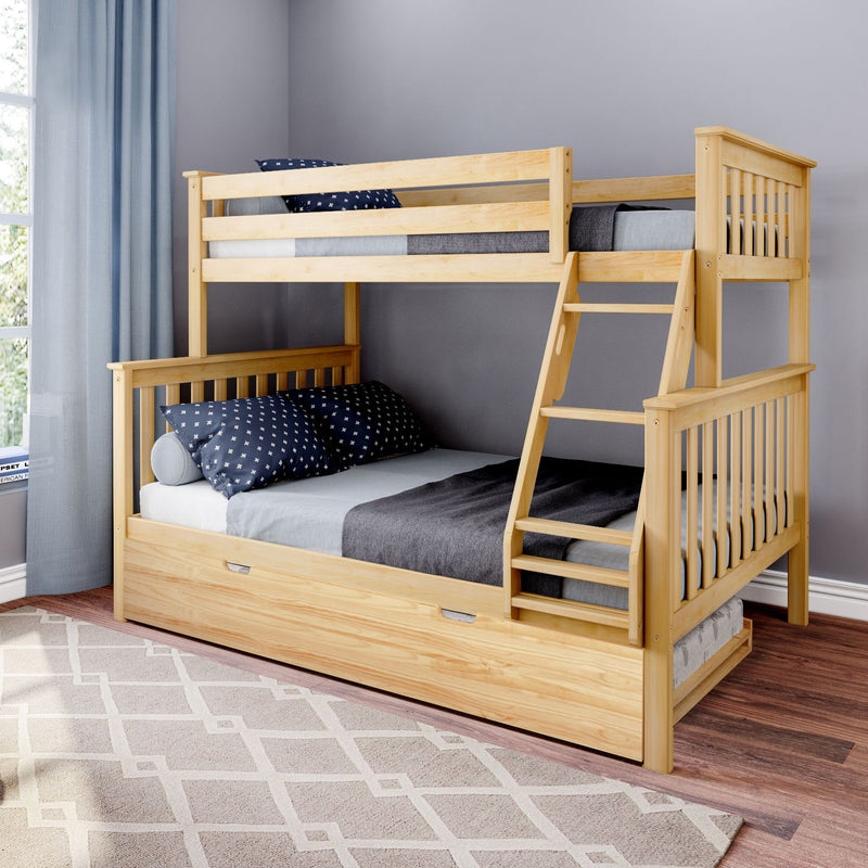 Natural pine wooden bunk bed with ladder and under-bed trundle, navy star pillows and gray bedding in modern kids' bedroom